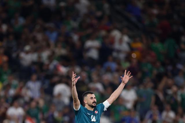 Iraq's forward #18 Aymen Hussein celebrates scoring his team's second goal during the 2026 FIFA World Cup qualifiers final playoff football match between Iraq and Bolivia at the BBVA Stadium in Guadalupe, Nuevo Leon state, Mexico, on March 31, 2026. (Photo by Julio Cesar AGUILAR / AFP)