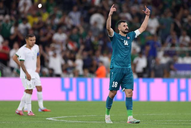 Iraq's forward #18 Aymen Hussein celebrates scoring his team's second goal during the 2026 FIFA World Cup qualifiers final playoff football match between Iraq and Bolivia at the BBVA Stadium in Guadalupe, Nuevo Leon state, Mexico, on March 31, 2026. (Photo by Julio Cesar AGUILAR / AFP)