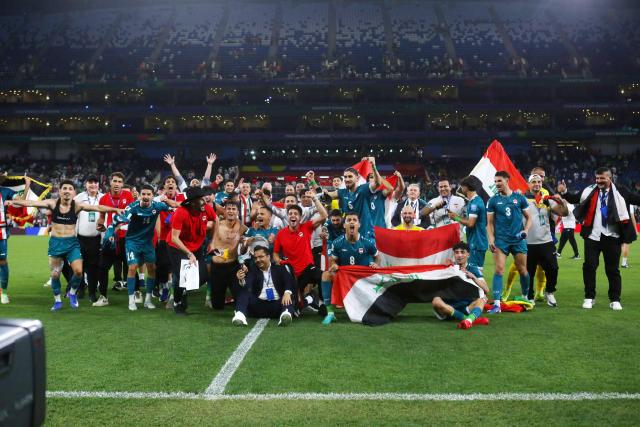 Iraq's players celebrate after winning the 2026 FIFA World Cup qualifiers final playoff football match between Iraq and Bolivia at the BBVA Stadium in Guadalupe, Nuevo Leon state, Mexico, on March 31, 2026. (Photo by Julio Cesar AGUILAR / AFP)