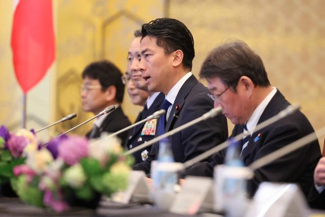 Motegi Toshimitsu, Japanese Minister for Foreign Affairs, and Koizumi Shinjiro, Japanese Defence Minister, attend a meeting with Jean-Noel Barrot, French Minister for Europe and Foreign Affairs and Catherine Vautrin, French Minister for the Armed Forces and Veterans Affairs (not in picture) at Iikura Guest House in Tokyo on April 1, 2026. (Photo by Rodrigo Reyes Marin / POOL / AFP)