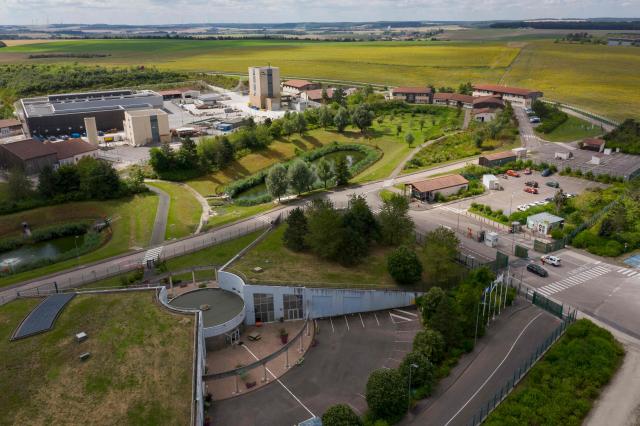 (FILES) This aerial photograph taken on August 8, 2024 shows the Meuse/Haute Marne Underground Research Laboratory of the nuclear waste burial site known as Cigeo (Centre Industriel de stockage Geologique - Industrial Centre for Geological Disposal), operated by the French National agency for the management of radioactive waste, Andra, in Bure, eastern France. The cost of Cigeo, a project to bury the most radioactive nuclear waste in Bure (Meuse), has been estimated by the state at 33.36 billion euros, up from the 25 billion envisaged in 2016, according to a decree published on April 1, 2026 in the Journal officiel. This updated total cost, based on January 2025 economic conditions, falls within the range estimated in May 2025 by the National Agency for Radioactive Waste Management (Andra), the project's developer, which stood between 26.1 and 37.5 billion euros. (Photo by Jean-Christophe VERHAEGEN / AFP)