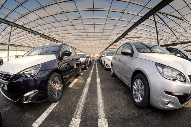 (FILES) A view of new Peugeot 308 cars by French car maker PSA Peugeot Citroen in the parking garage at the company's factory in Sochaux, eastern France, on March 6, 2014. The Peugeot 308 has been elected 'Car of the year' for 2014 at the Geneva motor show. New car sales in France rose 12.86% in March year-on-year, a rebound after a difficult start to the year for the automotive market, according to data published on April 1, 2026 by the Plateforme automobile (PFA), the sector's lobbying body. (Photo by SEBASTIEN BOZON / AFP)