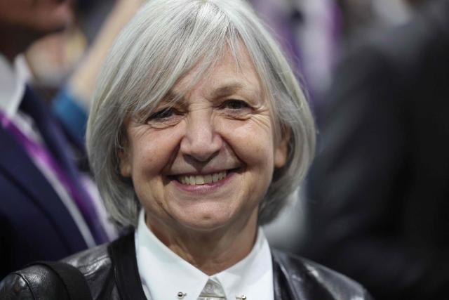 French Ambassador to Japan Beatrice Le Fraper du Hellen smiles for a group photo with President Emmanuel Macron (not pictured) and Japanese and French business leaders at the Tokyo Innovation Base (TIB) in Tokyo on April 1, 2026. (Photo by Ludovic MARIN / POOL / AFP)