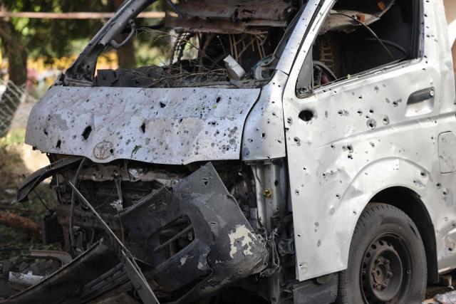 A photograph shows a shrapnel-riddled vehicle at the site of an Israeli strike in Beirut on April 1, 2026. Lebanon was drawn into the Middle East war on March 2 when Tehran-backed militant group Hezbollah launched attacks on Israel to avenge the killing of the Iranian leader. Israel has responded with broad strikes across Lebanon and a ground offensive. (Photo by Anwar AMRO / AFP)
