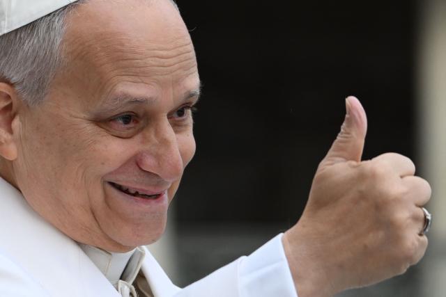 Pope Leo XIV gestures a thumb-up as he arrives to lead his weekly general audience at St. Peter’s square in the Vatican on April 1, 2026. (Photo by Alberto PIZZOLI / AFP)