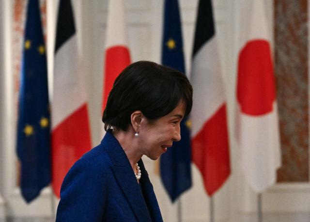 Japanese Prime Minister Sanae Takaichi arrives to meet with French President Emmanuel Macron during a welcome ceremony at the Akasaka palace in Tokyo on April 1, 2026. (Photo by Philip FONG / POOL / AFP)