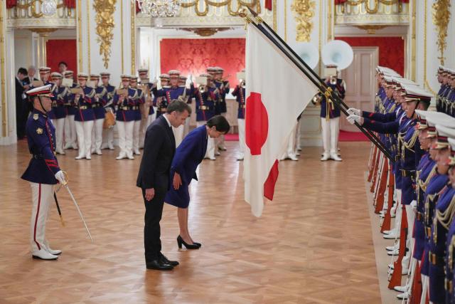 Japan?fs Prime Minister Sanae Takaichi (C) and French President Emmanuel Macron review an honor guard during a welcome ceremony at the Akasaka Palace State Guest House in Tokyo on April 1, 2026. (Photo by Hiro Komae / POOL / AFP)