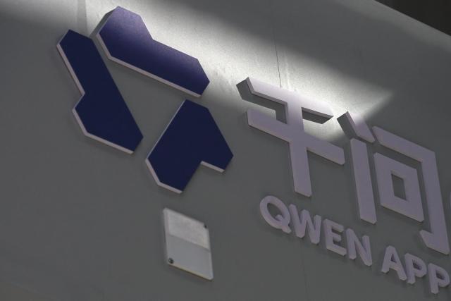 A logo of Alibaba’s AI product QWen is pictured during a tour at the Alibaba office in Beijing on April 1, 2026. (Photo by WANG Zhao / AFP)