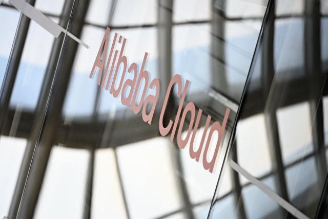 Alibaba Cloud signage is pictured during a tour at the Alibaba office in Beijing on April 1, 2026. (Photo by WANG Zhao / AFP)