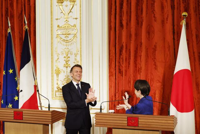Japan's Prime Minister Sanae Takaichi and French President Emmanuel Macron react during a press conference at Akasaka Palace in Tokyo on April 1, 2026. (Photo by Franck ROBICHON / POOL / AFP)