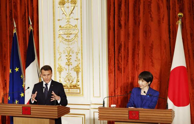 Japan's Prime Minister Sanae Takaichi and French President Emmanuel Macron react attend a press conference at Akasaka Palace in Tokyo on April 1, 2026. (Photo by Franck ROBICHON / POOL / AFP)