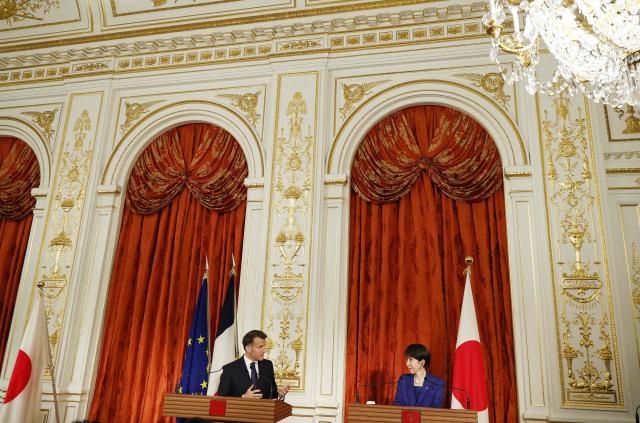 Japan's Prime Minister Sanae Takaichi and French President Emmanuel Macron react attend a press conference at Akasaka Palace in Tokyo on April 1, 2026. (Photo by Franck ROBICHON / POOL / AFP)