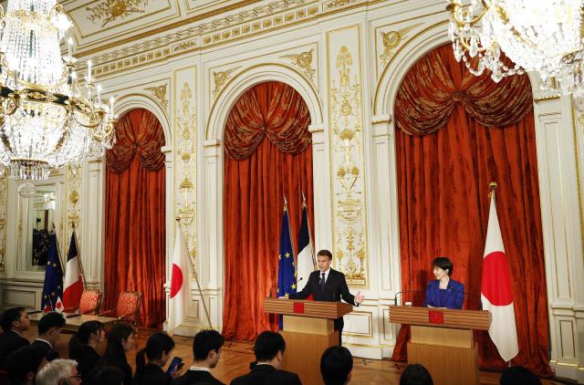 Japan's Prime Minister Sanae Takaichi and French President Emmanuel Macron react attend a press conference at Akasaka Palace in Tokyo on April 1, 2026. (Photo by Franck ROBICHON / POOL / AFP)