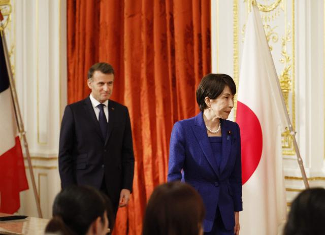 Japan's Prime Minister Sanae Takaichi and French President Emmanuel Macron react attend a press conference at Akasaka Palace in Tokyo on April 1, 2026. (Photo by Franck ROBICHON / POOL / AFP)