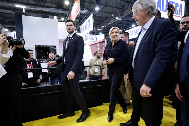 Far-right Rassemblement National (RN) parliamentary group president Marine Le Pen (C) visits the Global Industrie trade show at the Paris Nord Villepinte exhibition centre in Villepinte,  northeast of Paris, on April 1, 2026. (Photo by STEPHANE DE SAKUTIN / AFP)