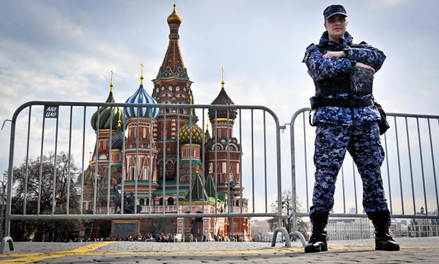 A Russian National Guard (Rosgvardia) serviceman stands guard on Red Square in front of St. Basil's Cathedral in central Moscow on April 1, 2026. (Photo by Alexander NEMENOV / AFP)