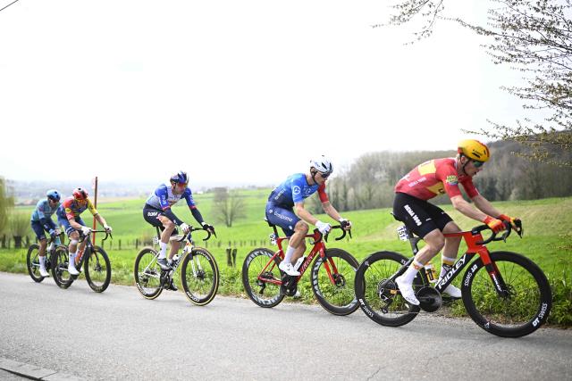 Netherlands' Mick Van Dijke of Red Bull-BORA-hansgrohe (3rd L), France's Thibaud Gruel of Groupama-FDJ United ) and Norway's Jonas Abrahamsen of Uno-X Mobility (R) compete during the men's elite race of the Dwars door Vlaanderen cycling event, 184.6km from Roeselare to Waregem on April 1, 2026. (Photo by JASPER JACOBS / Belga / AFP) / Belgium OUT
