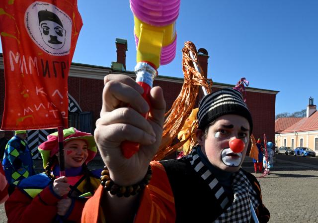 Clowns and mimes perform during April Fools' Day celebrations in Saint Petersburg, on April 1, 2026. (Photo by Olga MALTSEVA / AFP)