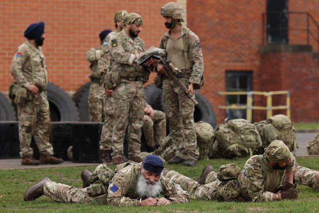 Soldiers from the Defence Sikh Network and British Army take part in Holla Mohalla, the annual Sikh military festival, celebrating Sikh martial traditions at the Royal Military Academy at Sandhurst on April 01, 2026. Participants took part in a soldier Role fitness test, traditional Sikh martial arts, traditional Sikh military games, and Rang colour powder throwing. The centuries old festival is held in the spirit of fierce but well natured competition and aims to promote courage, preparation, and readiness. Sikhs have been serving in the British Army since the 1800s. (Photo by Adrian Dennis / AFP)