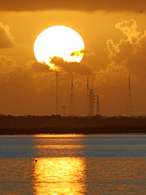 NASA's Artemis II Space Launch System (SLS) rocket is seen at sunrise at the Kennedy Space Center in Cape Canaveral, Florida on April 1, 2026. The first window to launch from the Kennedy Space Center in Florida opens Wednesday, April 1 at 6:24 pm (22:24 GMT), and NASA officials said the countdown began at 4:44 pm. (Photo by Gregg Newton / AFP)