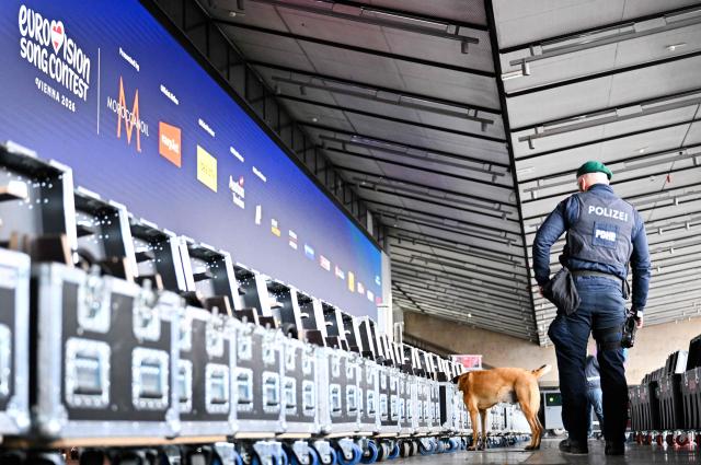 A police officer accompanied by an explosive-detection dog attends the presentation of security preparations for the Eurovision Song Contest (ESC) at the Stadthalle in Vienna on April 1, 2026. The Austrian capital Vienna will host the Eurovision Song Contest 2026 from May 12 to 16, 2026. (Photo by HANS KLAUS TECHT / APA / AFP) / Austria OUT