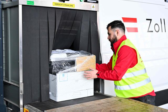 Customs personnel performs a security check using a scanner during the presentation of security preparations for the Eurovision Song Contest (ESC) at the Stadthalle in Vienna on April 1, 2026. The Austrian capital Vienna will host the Eurovision Song Contest 2026 from May 12 to 16, 2026. (Photo by HANS KLAUS TECHT / APA / AFP) / Austria OUT