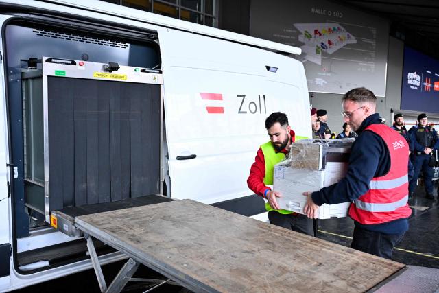 Customs personnel performs a security check using a scanner during the presentation of security preparations for the Eurovision Song Contest (ESC) at the Stadthalle in Vienna on April 1, 2026. The Austrian capital Vienna will host the Eurovision Song Contest 2026 from May 12 to 16, 2026. (Photo by HANS KLAUS TECHT / APA / AFP) / Austria OUT