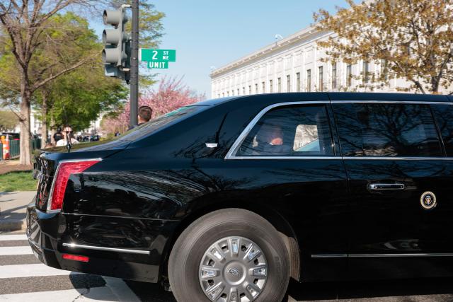 US President Donald Trump rides in his motorcade as he arrives at the US Supreme Court in Washington, DC on April 1, 2026. President Donald Trump will watch the US Supreme Court hear a landmark case weighing the constitutionality of his contentious bid to end birthright citizenship, an extraordinary and possibly unprecedented move for the nation's highest office. (Photo by Kent Nishimura / AFP)