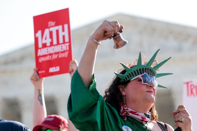 Demonstrators rally outside the US Supreme Court as President Donald Trump attends oral arguments in Washington, DC on April 1, 2026. President Donald Trump is watching in person as the US Supreme Court hears a landmark case weighing the constitutionality of his contentious bid to end birthright citizenship, an extraordinary and possibly unprecedented move for the nation's highest office. (Photo by Kent NISHIMURA / AFP)