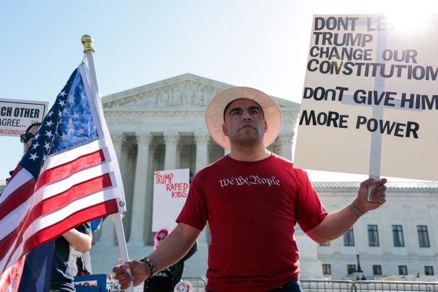 Demonstrators rally in support of birthright citizenship outside the US Supreme Court as President Donald Trump attends oral arguments in Washington, DC on April 1, 2026. President Donald Trump is watching in person as the US Supreme Court hears a landmark case weighing the constitutionality of his contentious bid to end birthright citizenship, an extraordinary and possibly unprecedented move for the nation's highest office. (Photo by Kent Nishimura / AFP)