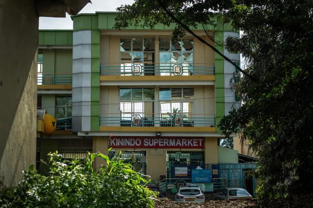 A general view of a building with shattered windows following explosions after a fire at a military arsenal in the Kinindo district of Bujumbura, on April 1, 2026. Explosions that ripped through the city of Bujumbura after a fire in a military arsenal have killed several dozen people in the Burundian economic capital, security sources told AFP on April 1, 2026.
The explosions erupted late on March 31, 2026 at the main ammunition depot of the Burundi National Defence Force (FDNB) in Musaga, a southern suburb of Bujumbura. (Photo by Fabrice Mbonankira / AFP)