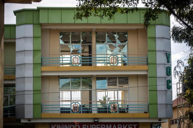 A general view of a building with shattered windows following explosions after a fire at a military arsenal in the Kinindo district of Bujumbura, on April 1, 2026. Explosions that ripped through the city of Bujumbura after a fire in a military arsenal have killed several dozen people in the Burundian economic capital, security sources told AFP on April 1, 2026.
The explosions erupted late on March 31, 2026 at the main ammunition depot of the Burundi National Defence Force (FDNB) in Musaga, a southern suburb of Bujumbura. (Photo by Fabrice Mbonankira / AFP)