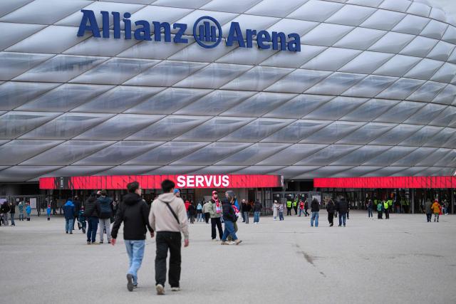 People arrive at the Allianz arena prior to the UEFA Women's Champions League, Quarter Final second-leg football match between FC Bayern Munich and Manchester United in Munich on April, 1 2026. (Photo by Markus FISCHER / AFP)