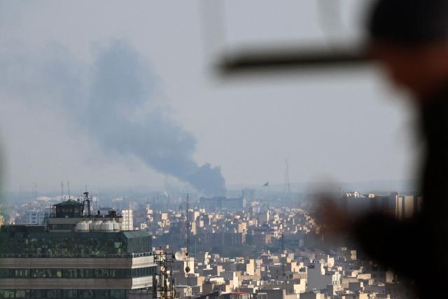 Smoke rises from the site of a strike in Tehran on April 1, 2026. An AFP journalist reported several huge explosions in the west of the Iranian capital Tehran on April 1 afternoon. It was unclear what the target was. Israel said earlier on April 1 it had struck several targets in Tehran. (Photo by AFP) / 
