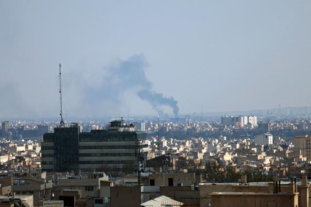 Smoke rises from the site of a strike in Tehran on April 1, 2026. An AFP journalist reported several huge explosions in the west of the Iranian capital Tehran on April 1 afternoon. It was unclear what the target was. Israel said earlier on April 1 it had struck several targets in Tehran. (Photo by AFP) / 