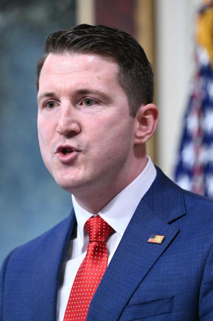 Colin McDonald, the Assistant Attorney General for the National Fraud Enforcement Division, speaks after being sworn in by US Vice President JD Vance in the Eisenhower Executive Office Building, next to the White House in Washington, DC on April 1, 2026. McDonald will be the first Assistant Attorney General for the Department of Justice's newly created National Fraud Enforcement Division. (Photo by Mandel NGAN / AFP)