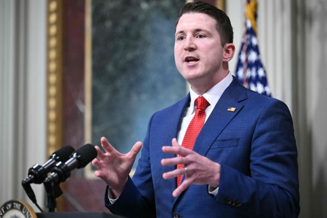 Colin McDonald, the Assistant Attorney General for the National Fraud Enforcement Division, speaks after being sworn in by US Vice President JD Vance in the Eisenhower Executive Office Building, next to the White House in Washington, DC on April 1, 2026. McDonald will be the first Assistant Attorney General for the Department of Justice's newly created National Fraud Enforcement Division. (Photo by Mandel NGAN / AFP)