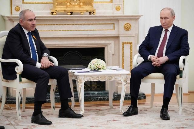 Russian President Vladimir Putin (L) speaks with Armenian Prime Minister Nikol Pashinyan during their meeting at the Kremlin in Moscow, on April 1, 2026. (Photo by Pavel Bednyakov / POOL / AFP)