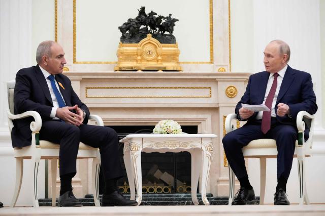 Russian President Vladimir Putin (L) speaks with Armenian Prime Minister Nikol Pashinyan during their meeting at the Kremlin in Moscow, on April 1, 2026. (Photo by Pavel Bednyakov / POOL / AFP)