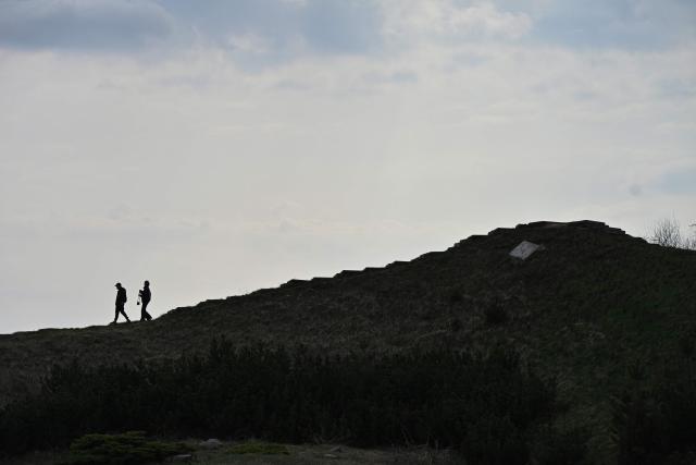 People walk through the Gryshko National Botanical Garden in Kyiv on April 1, 2026, amid the Russian invasion of Ukraine. (Photo by Genya SAVILOV / AFP)