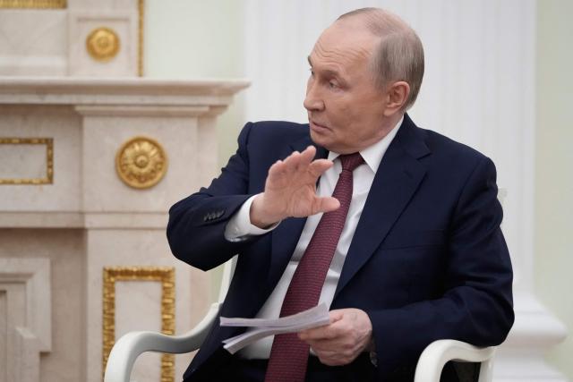 Russian President Vladimir Putin speaks to Armenian Prime Minister at the Kremlin in Moscow, on April 1, 2026. (Photo by Pavel Bednyakov / POOL / AFP)