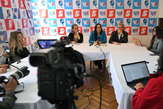 Ecuador's president of the Revolucion Ciudadana party, Gabriela Rivadeneira (C), speaks during a press conference for the foreign press at the party headquarters in Quito on April 1, 2026. The left-wing party Revolucion Ciudadana, which is aligned with former Ecuador's President Rafael Correa (2007–2017), was suspended for nine months in March 2026 due to a prosecutor’s investigation into alleged money laundering. (Photo by Rodrigo BUENDIA / AFP)