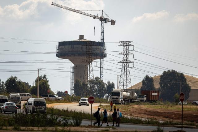A general view of a water tower in construction in Braamfischerville on April 1, 2026. (Photo by EMMANUEL CROSET / AFP)