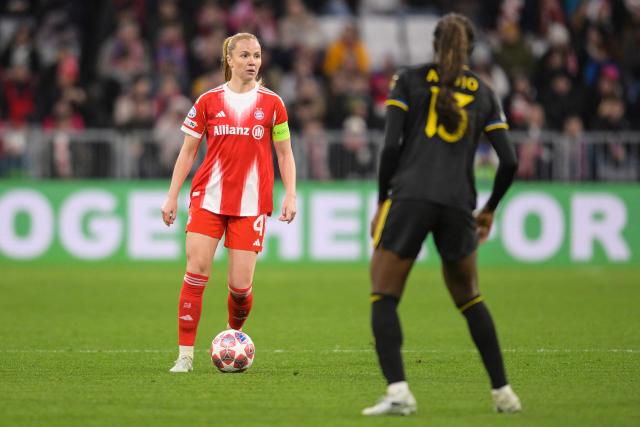 Bayern Munich's Icelandic defender #04 Glodis Viggosdottir (L) and Manchester United's Canadian midfielder #13 Simi Awujo vie for the ball during the UEFA Women's Champions League, Quarter Final second-leg football match between FC Bayern Munich and Manchester United in Munich on April, 1 2026. (Photo by Markus FISCHER / AFP)