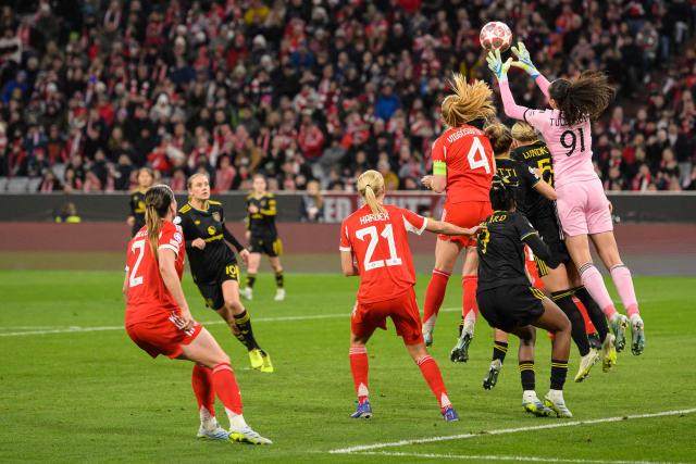 Manchester United's US goalkeeper #91 Phallon Tullis-Joyce (R) reaches the ball during the UEFA Women's Champions League, Quarter Final second-leg football match between FC Bayern Munich and Manchester United in Munich on April, 1 2026. (Photo by Markus FISCHER / AFP)