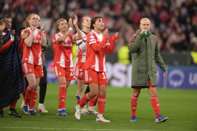 Bayern Munich's Japanese midfielder #18 Momoko Tanikawa celebrates with team mates after the UEFA Women's Champions League, Quarter Final second-leg football match between FC Bayern Munich and Manchester United in Munich on April, 1 2026. (Photo by Markus FISCHER / AFP)