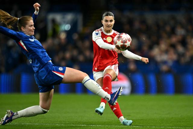 Chelsea's German midfielder #06 Sjoeke Nusken blocks the shot of Arsenal's Australian defender #07 Steph Catley during the UEFA Women's Champions League Quarter Final second-leg football match between Chelsea and Arsenal at Stamford Bridge in London on April 1, 2026. (Photo by Ben STANSALL / AFP)