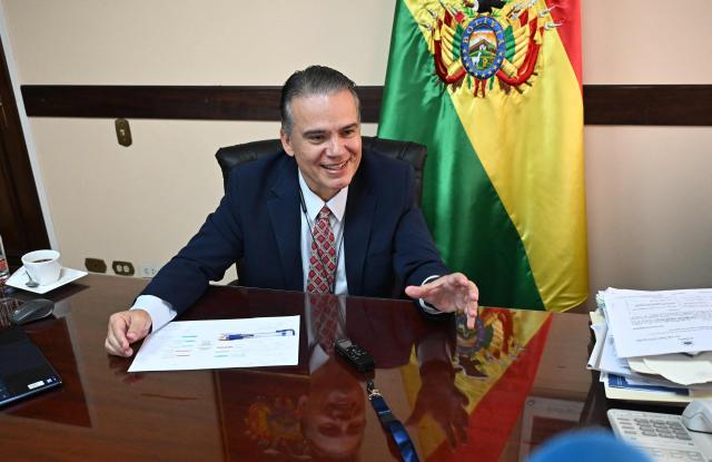 Bolivia's Vice Minister of Social Defense and anti-drug czar Ernesto Justiniano smiles during an interview with AFP in La Paz on April 1, 2026. Bolivia resumes joint investigations into drug trafficking cases with the US Drug Enforcement Administration (DEA) after an 18-year absence, anti-drug czar Ernesto Justiniano told AFP on April 1, 2026. (Photo by Aizar RALDES / AFP)