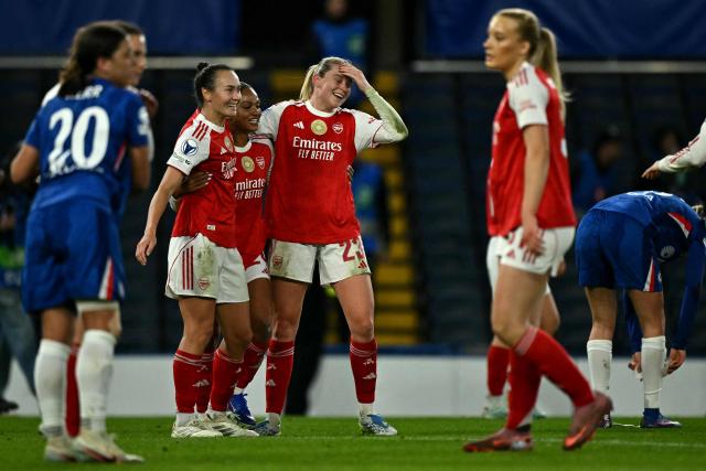 Arsenal's Australian striker #19 Caitlin Foord and Arsenal's English striker #23 Alessia Russo celebrate following the UEFA Women's Champions League Quarter Final second-leg football match between Chelsea and Arsenal at Stamford Bridge in London on April 1, 2026. (Photo by Ben STANSALL / AFP)