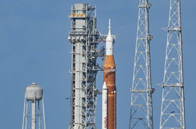 NASA's Artemis II Space Launch System rocket and Orion spacecraft rest on Launch Pad 39B at Kennedy Space Center in Cape Canaveral, Florida, on April 1, 2026, ahead of the crewed lunar mission. Three men and one woman are set to embark on the first crewed journey to the Moon since 1972, a landmark odyssey that aims to launch the US into a new era of space exploration. The NASA mission dubbed Artemis 2 has been years in the making after facing repeated setbacks, but is finally scheduled to take off from Florida as early as April 1 at 6:24 pm (2224 GMT). (Photo by Jim WATSON / AFP)